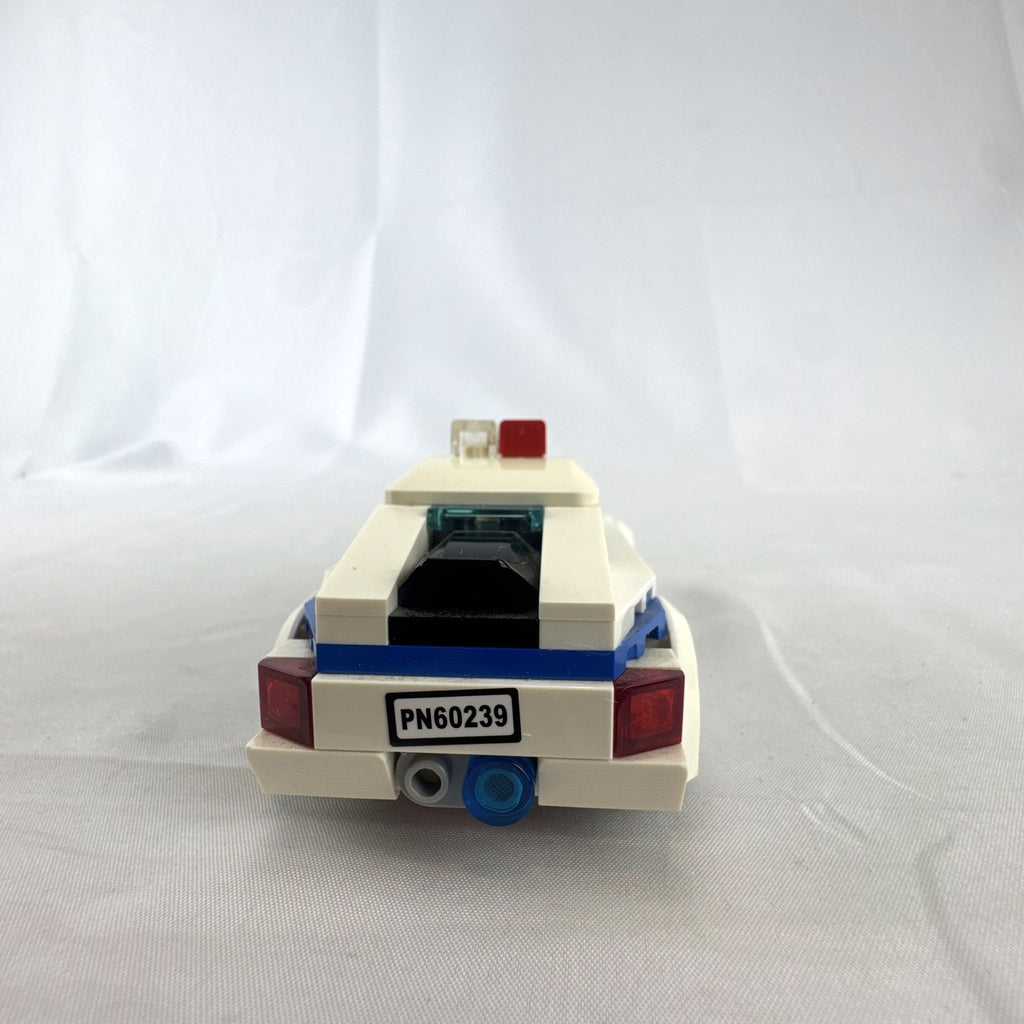 LEGO City Police Patrol Car set 60239 with police officer minifigure and instruction manual