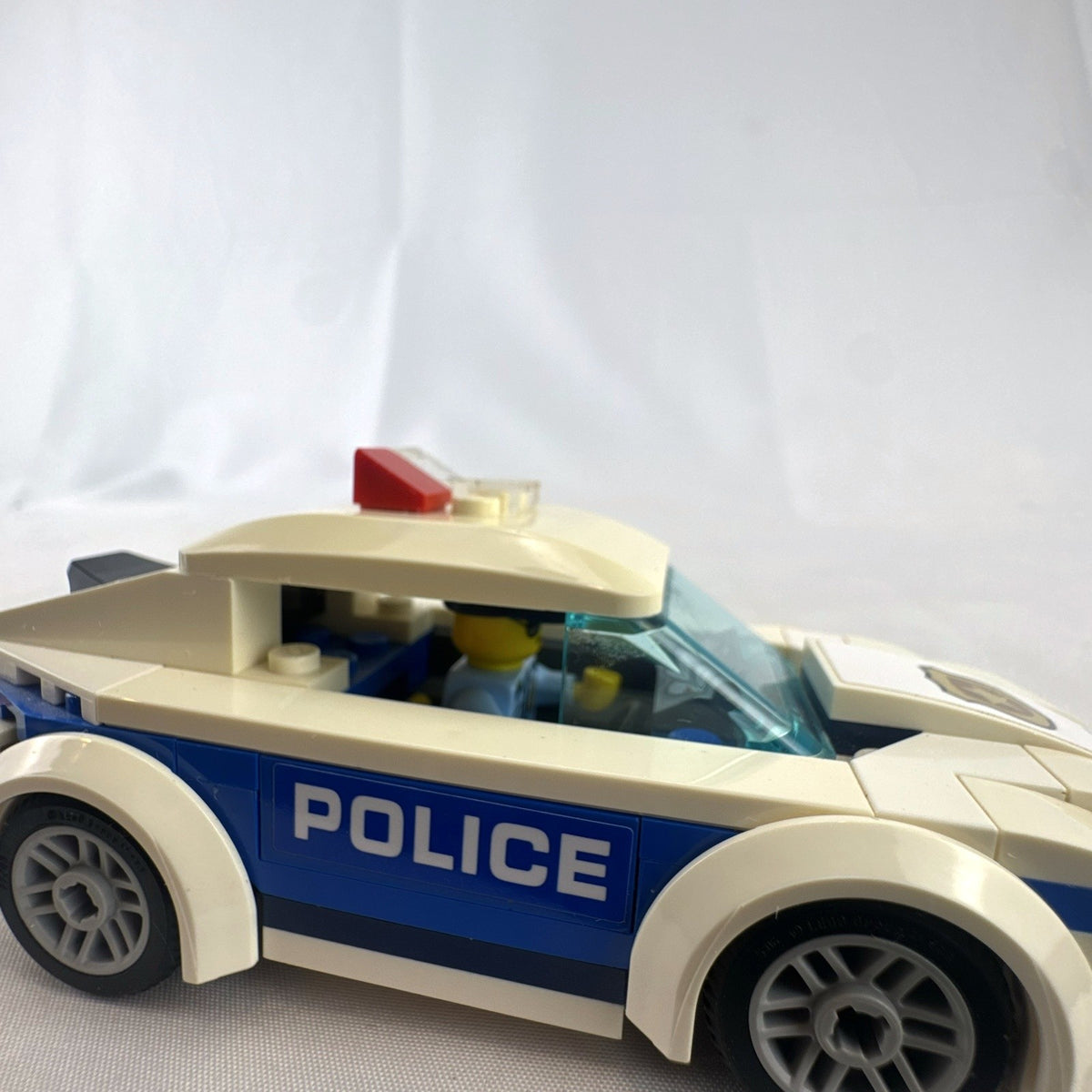 LEGO City Police Patrol Car set 60239 with police officer minifigure and instruction manual