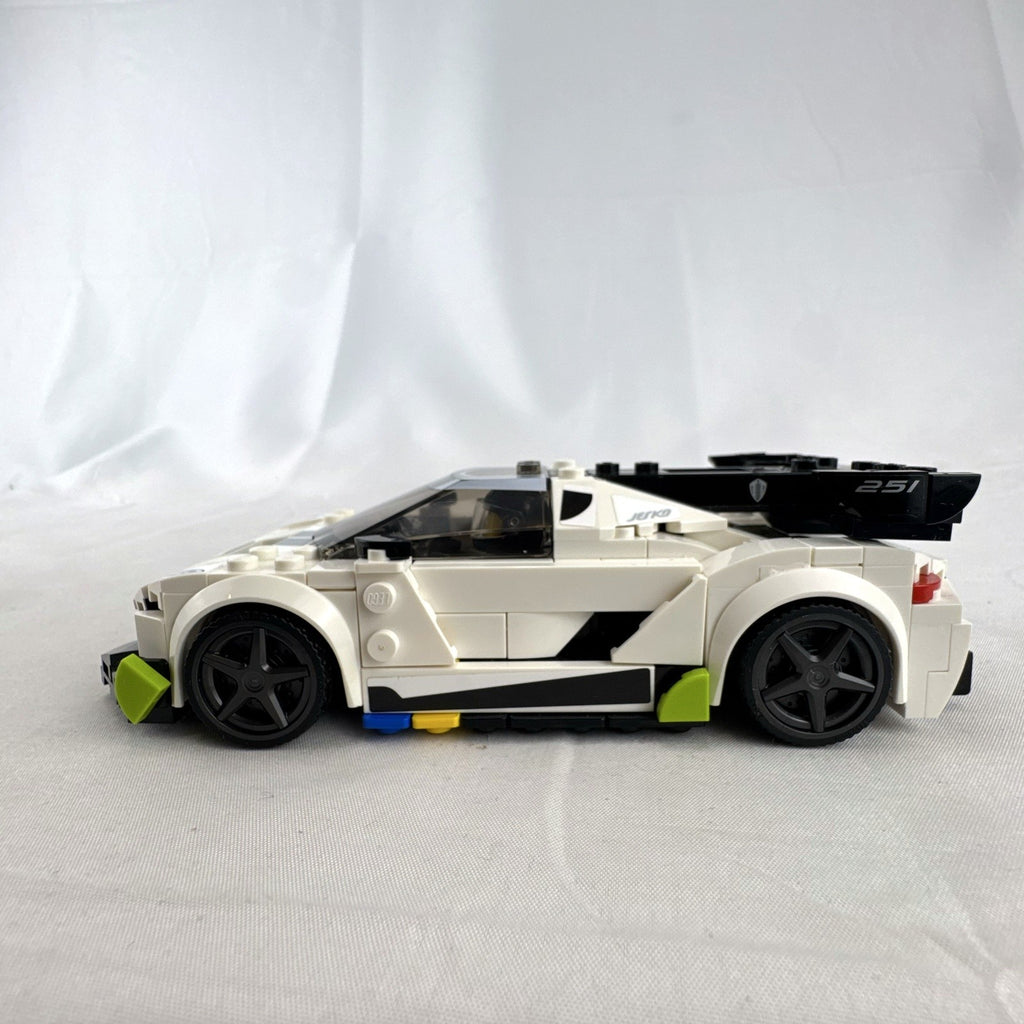 Assembled LEGO Speed Champions Koenigsegg Jesko 76900 white race car with original packaging and instruction booklet