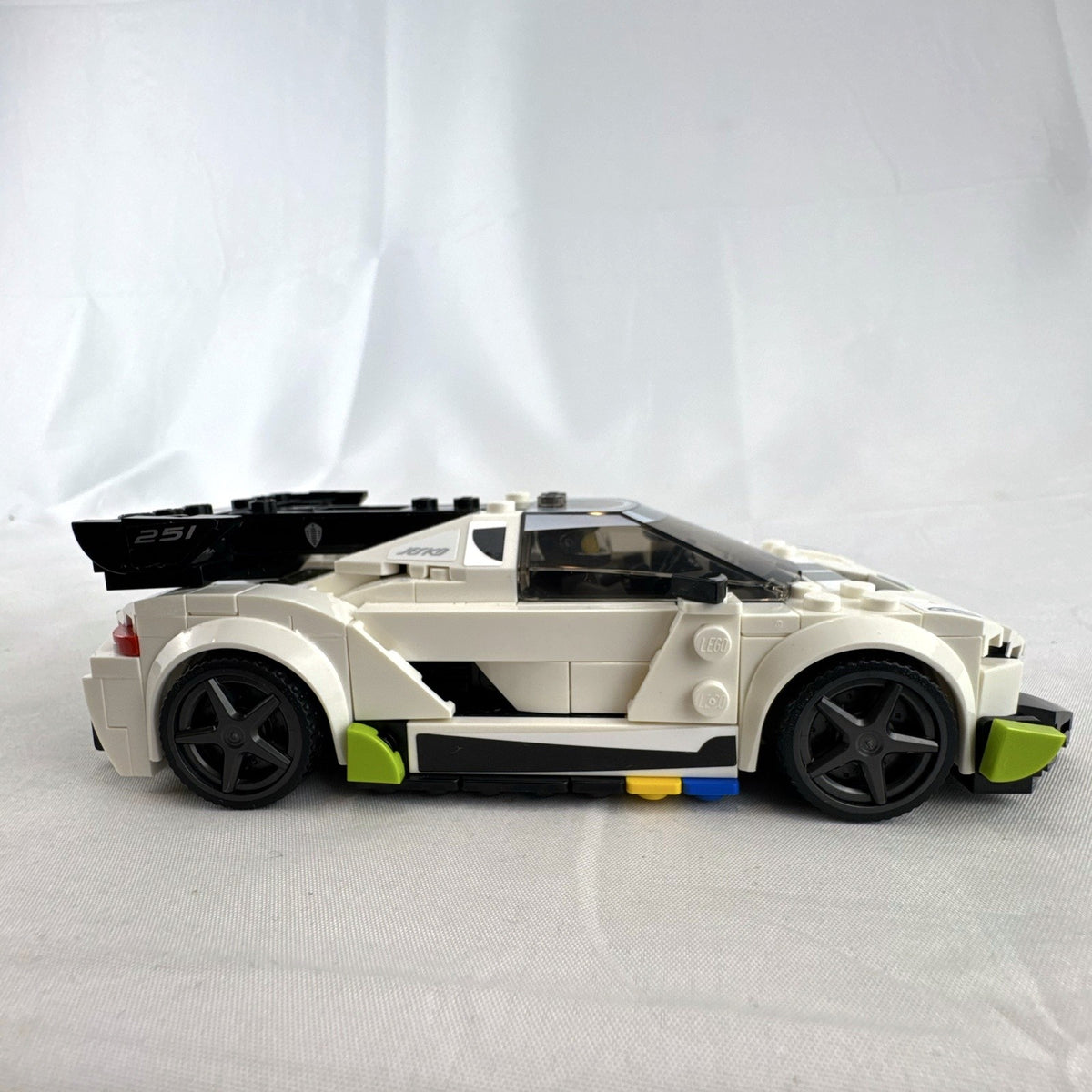 Assembled LEGO Speed Champions Koenigsegg Jesko 76900 white race car with original packaging and instruction booklet