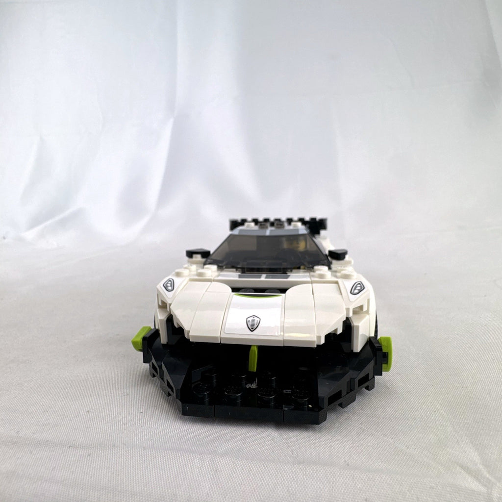 Assembled LEGO Speed Champions Koenigsegg Jesko 76900 white race car with original packaging and instruction booklet