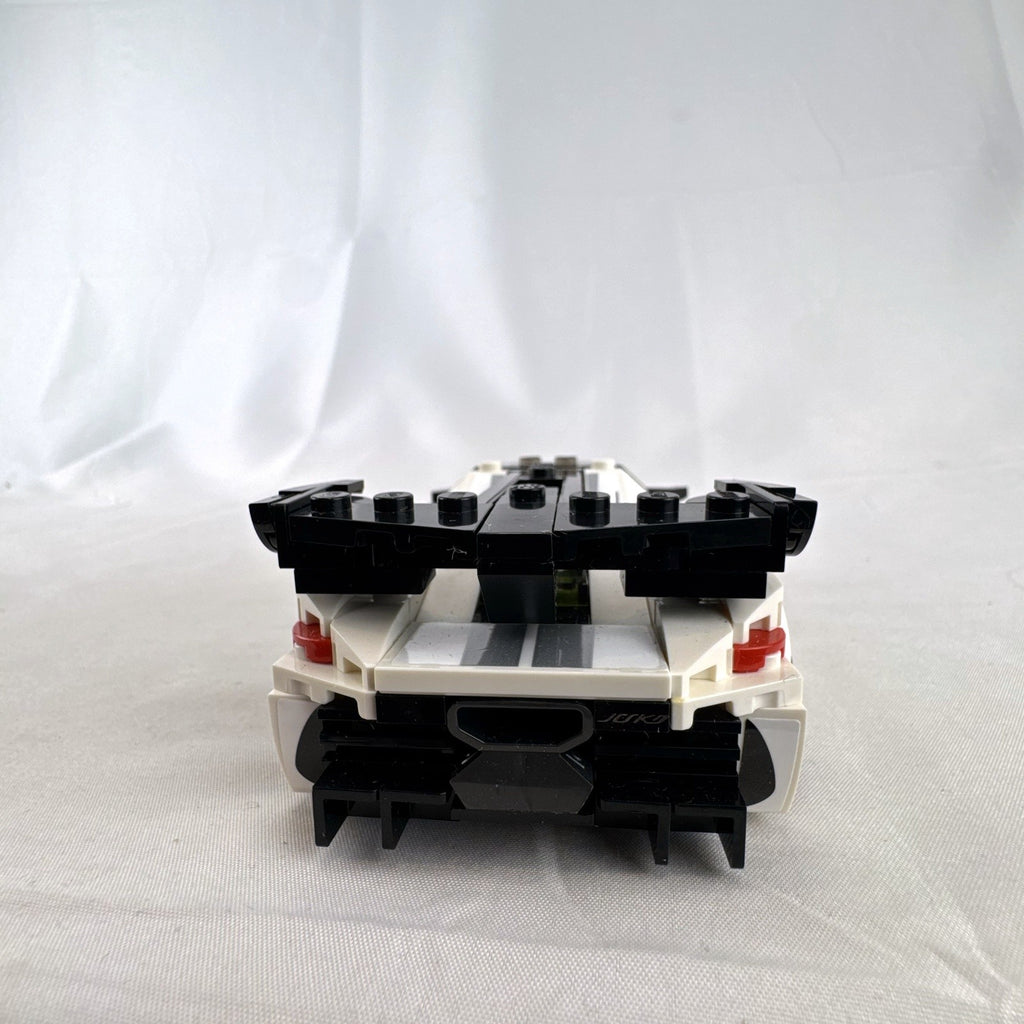 Assembled LEGO Speed Champions Koenigsegg Jesko 76900 white race car with original packaging and instruction booklet
