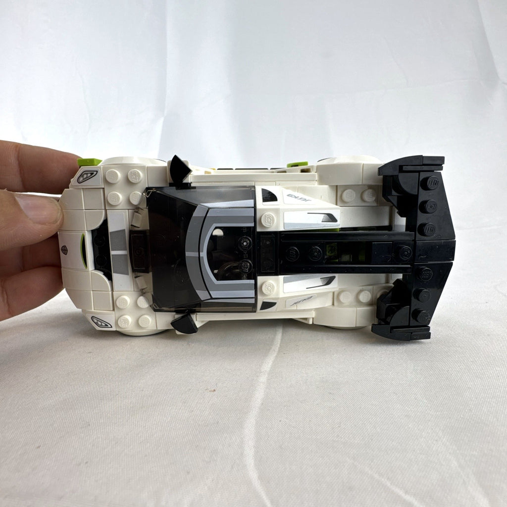 Assembled LEGO Speed Champions Koenigsegg Jesko 76900 white race car with original packaging and instruction booklet