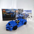 Assembled LEGO Speed Champions McLaren Elva set 76902 in blue with racing minifigure and original box