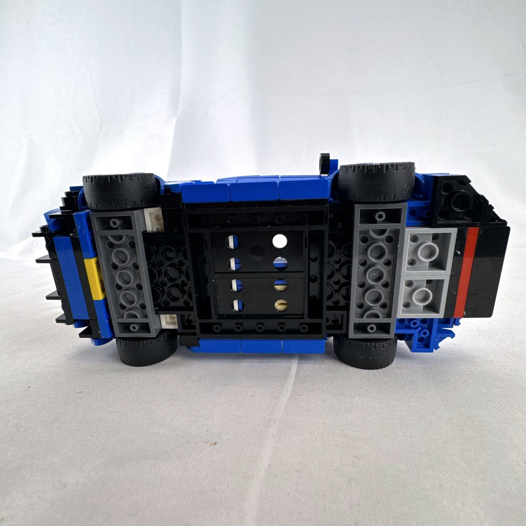 Assembled LEGO Speed Champions McLaren Elva set 76902 in blue with racing minifigure and original box