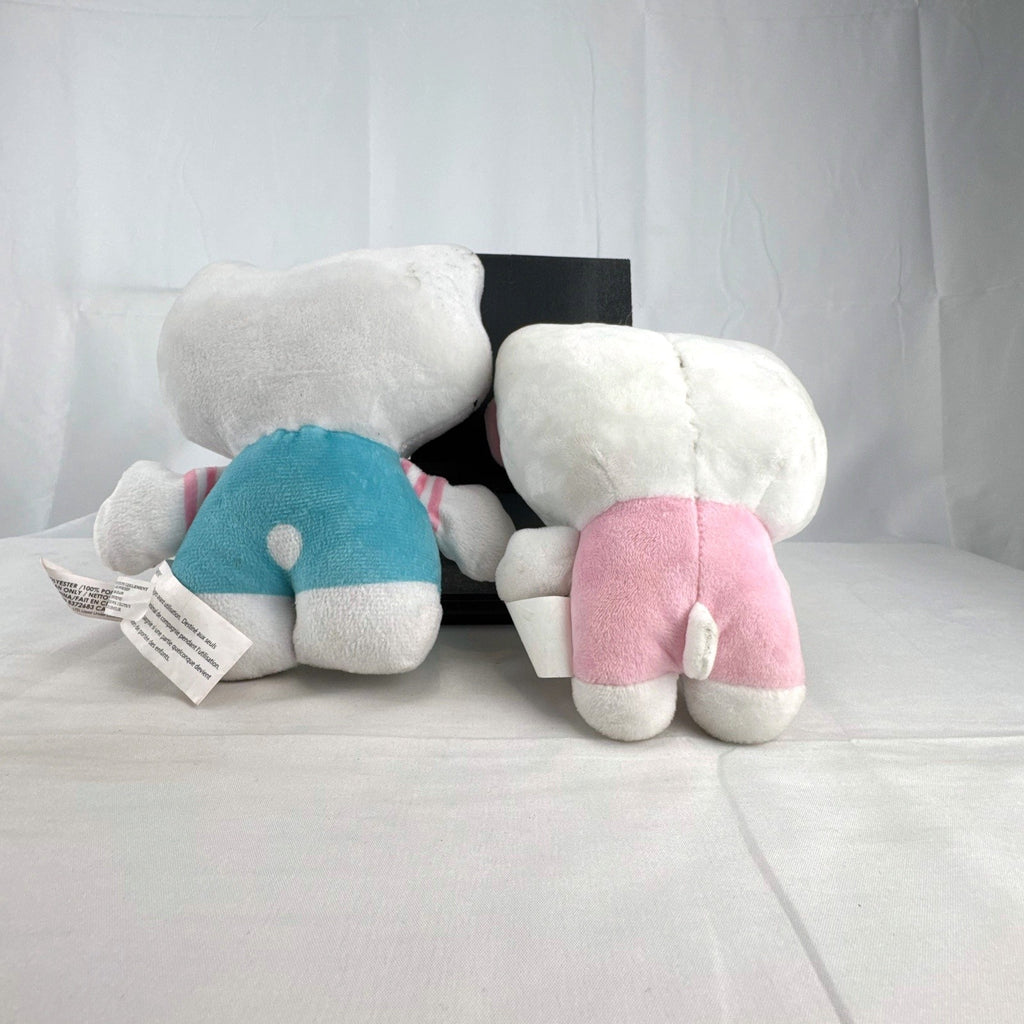 Pair of Sanrio Hello Kitty plush dolls wearing blue and pink overalls, measuring approximately 7 inches tall.