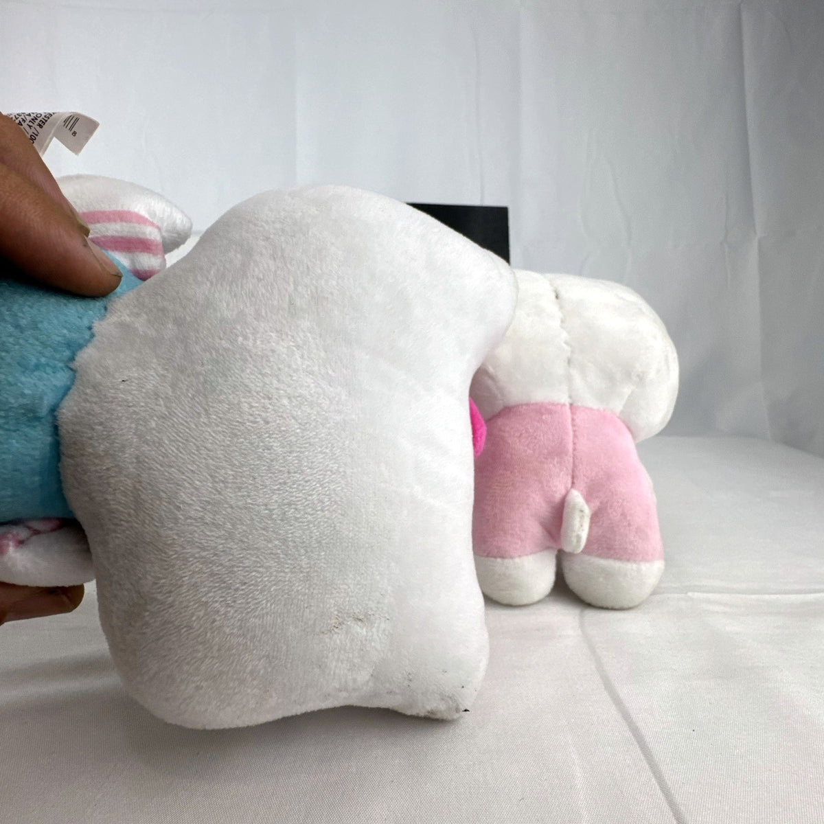 Pair of Sanrio Hello Kitty plush dolls wearing blue and pink overalls, measuring approximately 7 inches tall.