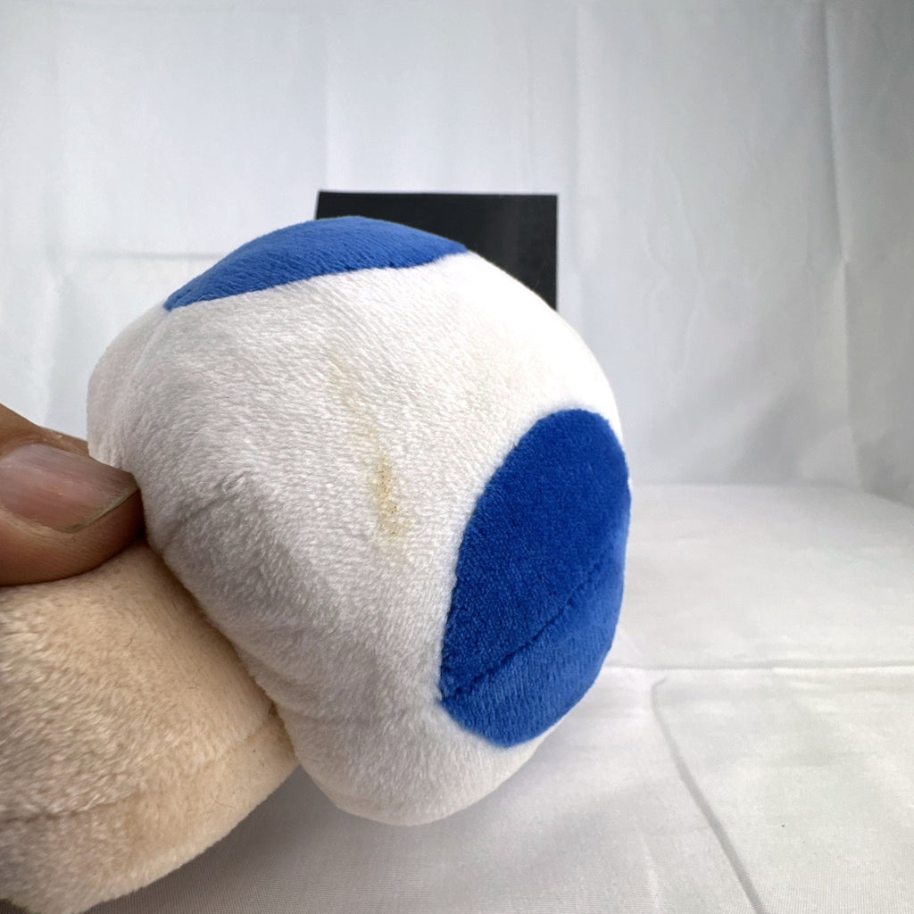 Nintendo Super Mario Bros. Blue Toad 7-inch plush toy with blue vest and spotted cap