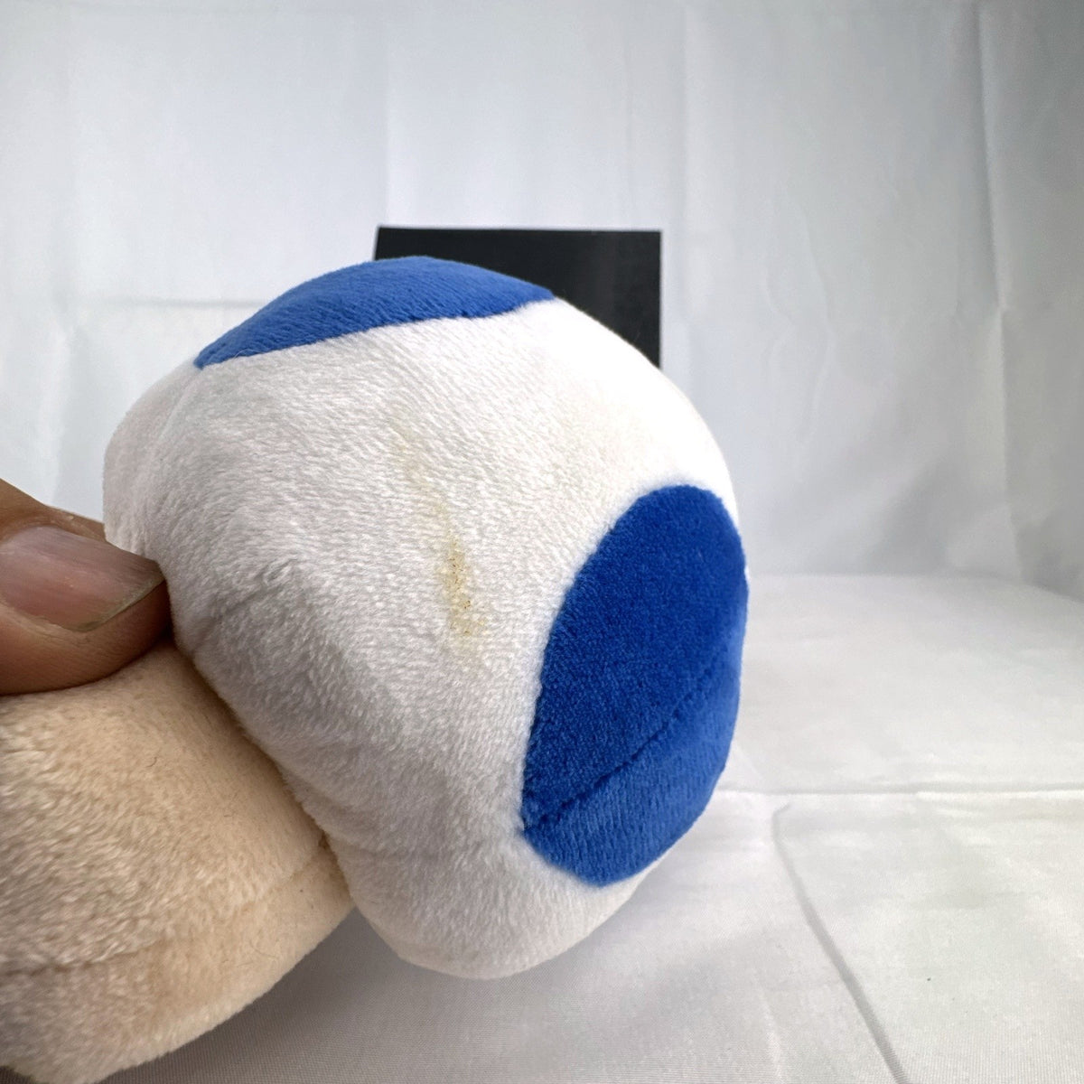 Nintendo Super Mario Bros. Blue Toad 7-inch plush toy with blue vest and spotted cap