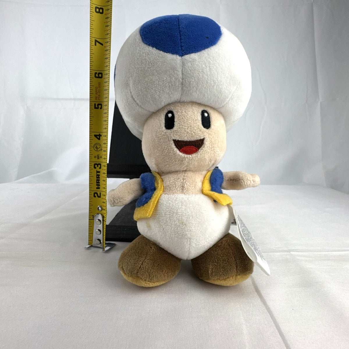 Nintendo Super Mario Bros. Blue Toad 7-inch plush toy with blue vest and spotted cap