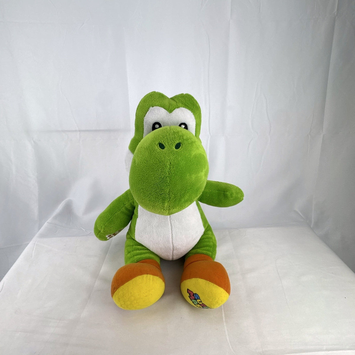 Build-A-Bear Workshop 16-inch green Yoshi plush featuring red shell and embroidered foot patch