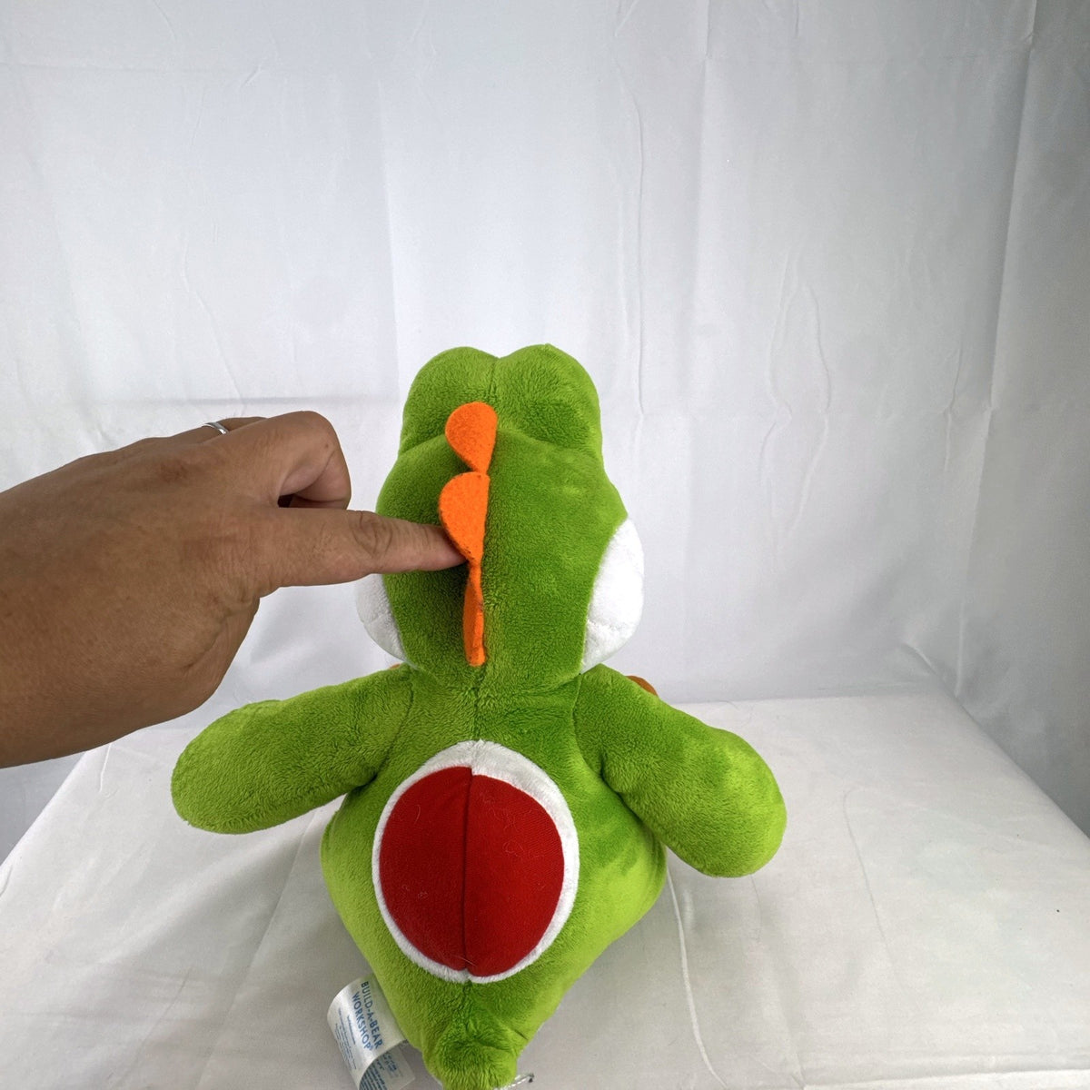 Build-A-Bear Workshop 16-inch green Yoshi plush featuring red shell and embroidered foot patch