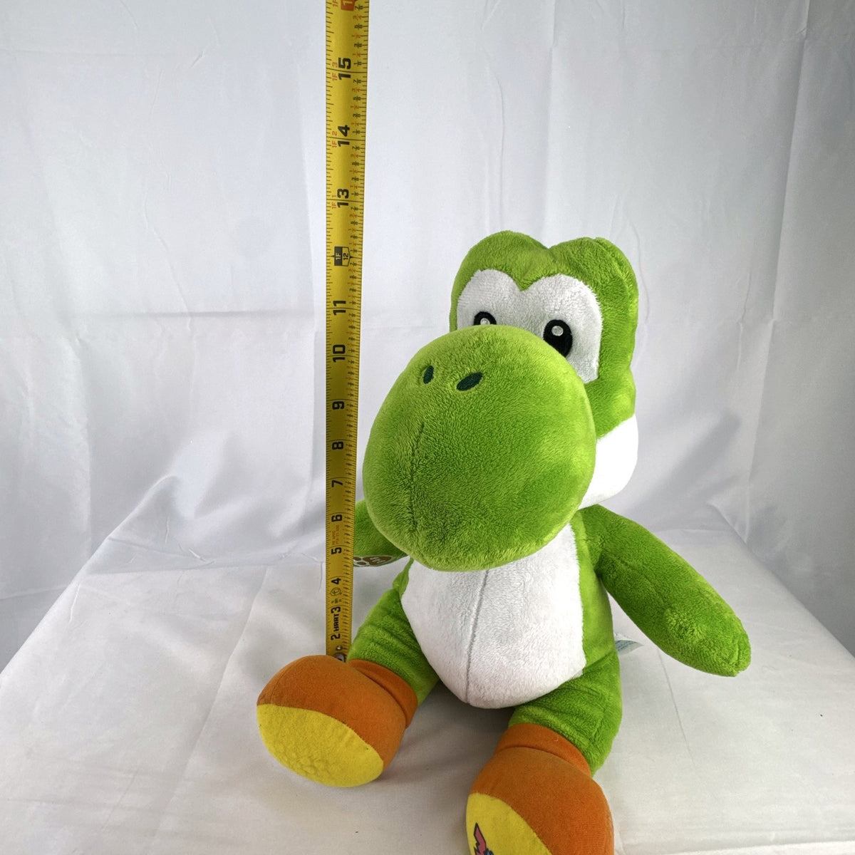Build-A-Bear Workshop 16-inch green Yoshi plush featuring red shell and embroidered foot patch