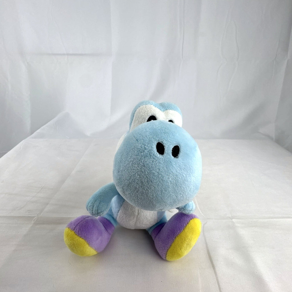 San-ei Nintendo light blue Yoshi plush stuffed animal showing red saddle shell and purple shoes