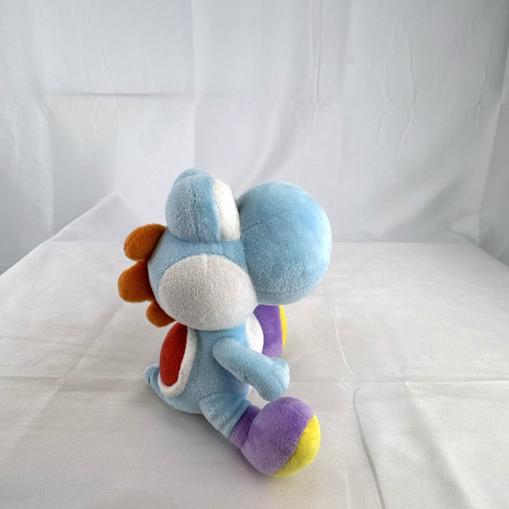 San-ei Nintendo light blue Yoshi plush stuffed animal showing red saddle shell and purple shoes
