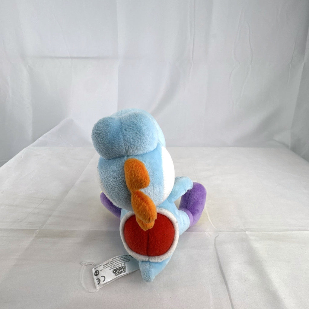 San-ei Nintendo light blue Yoshi plush stuffed animal showing red saddle shell and purple shoes