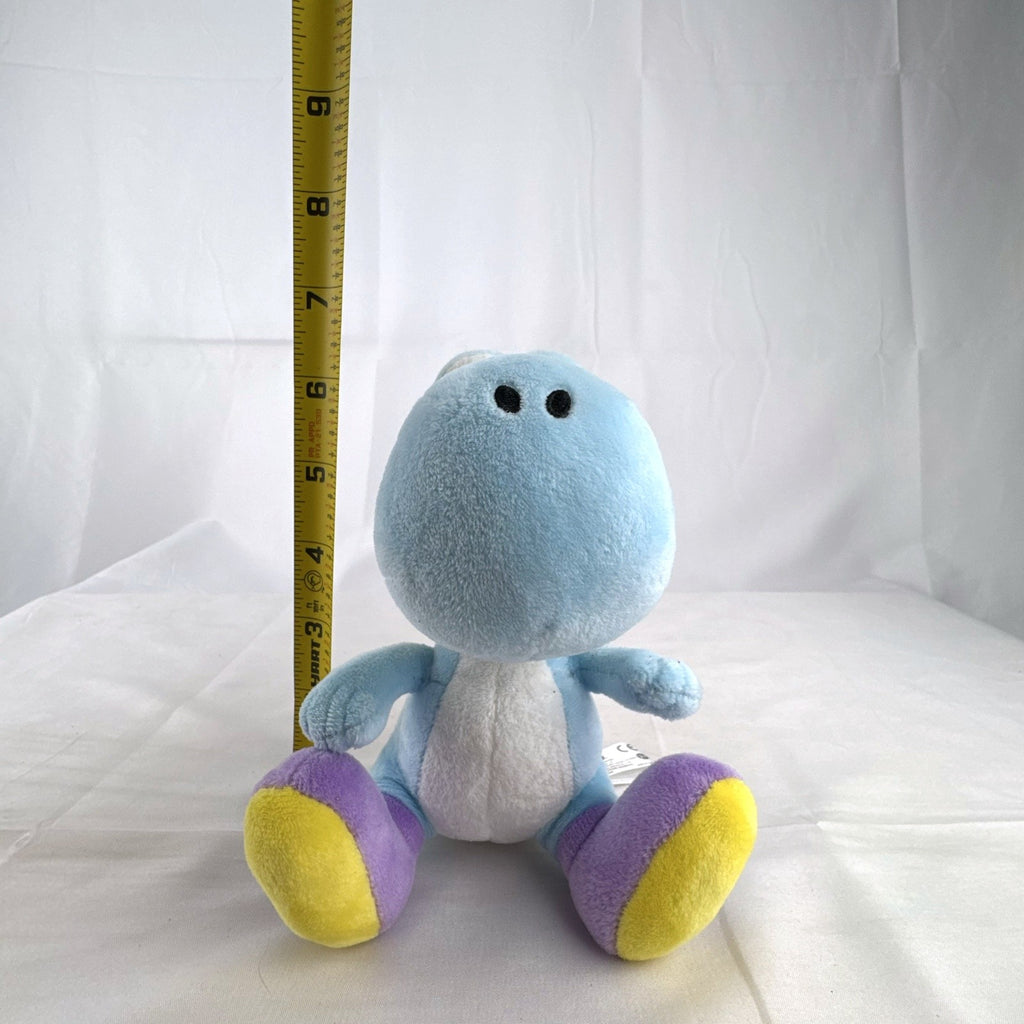 San-ei Nintendo light blue Yoshi plush stuffed animal showing red saddle shell and purple shoes