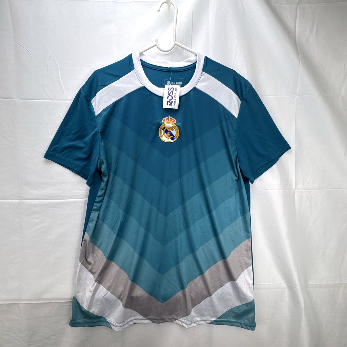 Real Madrid official men's size large soccer jersey in teal blue chevron pattern