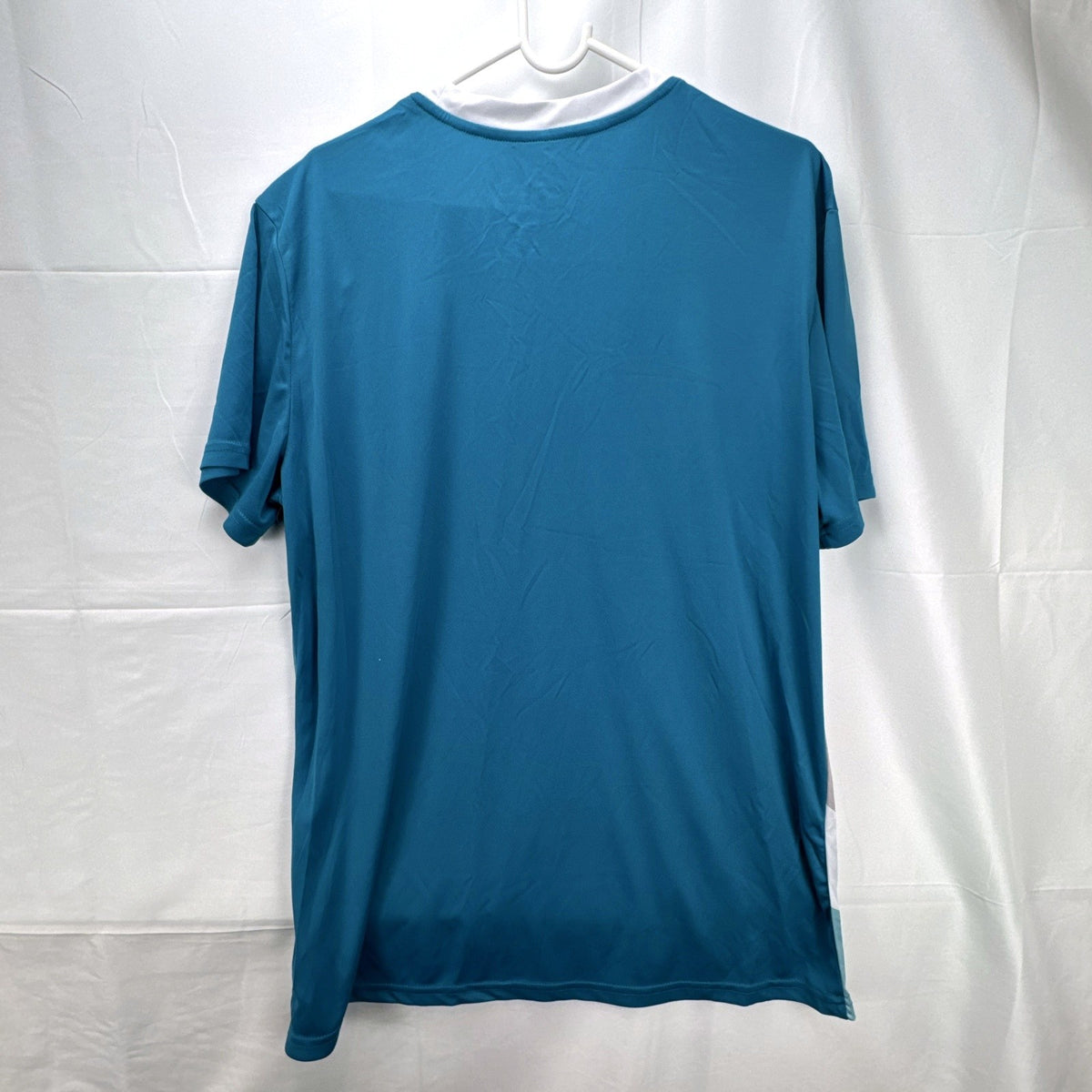 Real Madrid official men's size large soccer jersey in teal blue chevron pattern