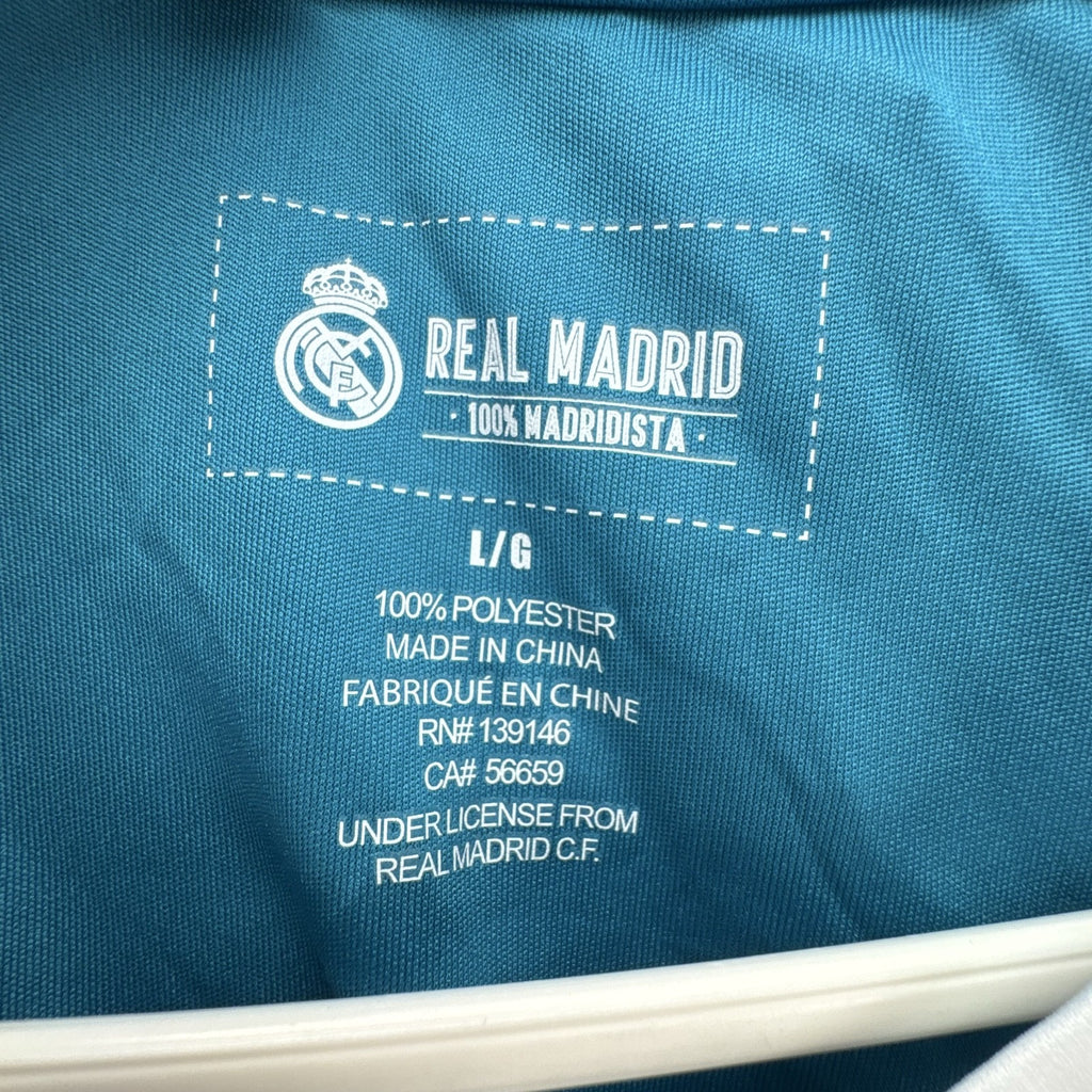 Real Madrid official men's size large soccer jersey in teal blue chevron pattern