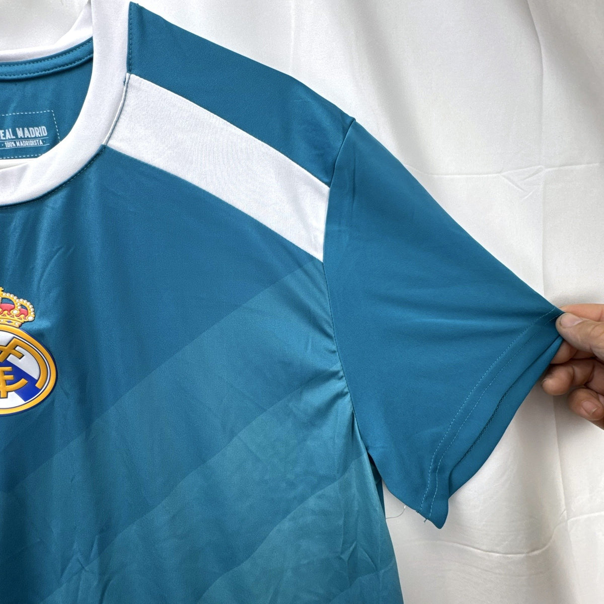 Real Madrid official men's size large soccer jersey in teal blue chevron pattern