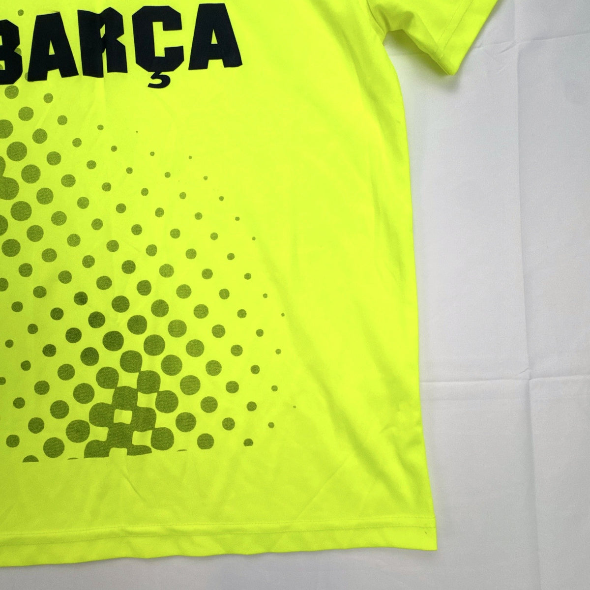 FC Barcelona neon yellow short sleeve soccer jersey with Barça crest graphic in men's size large