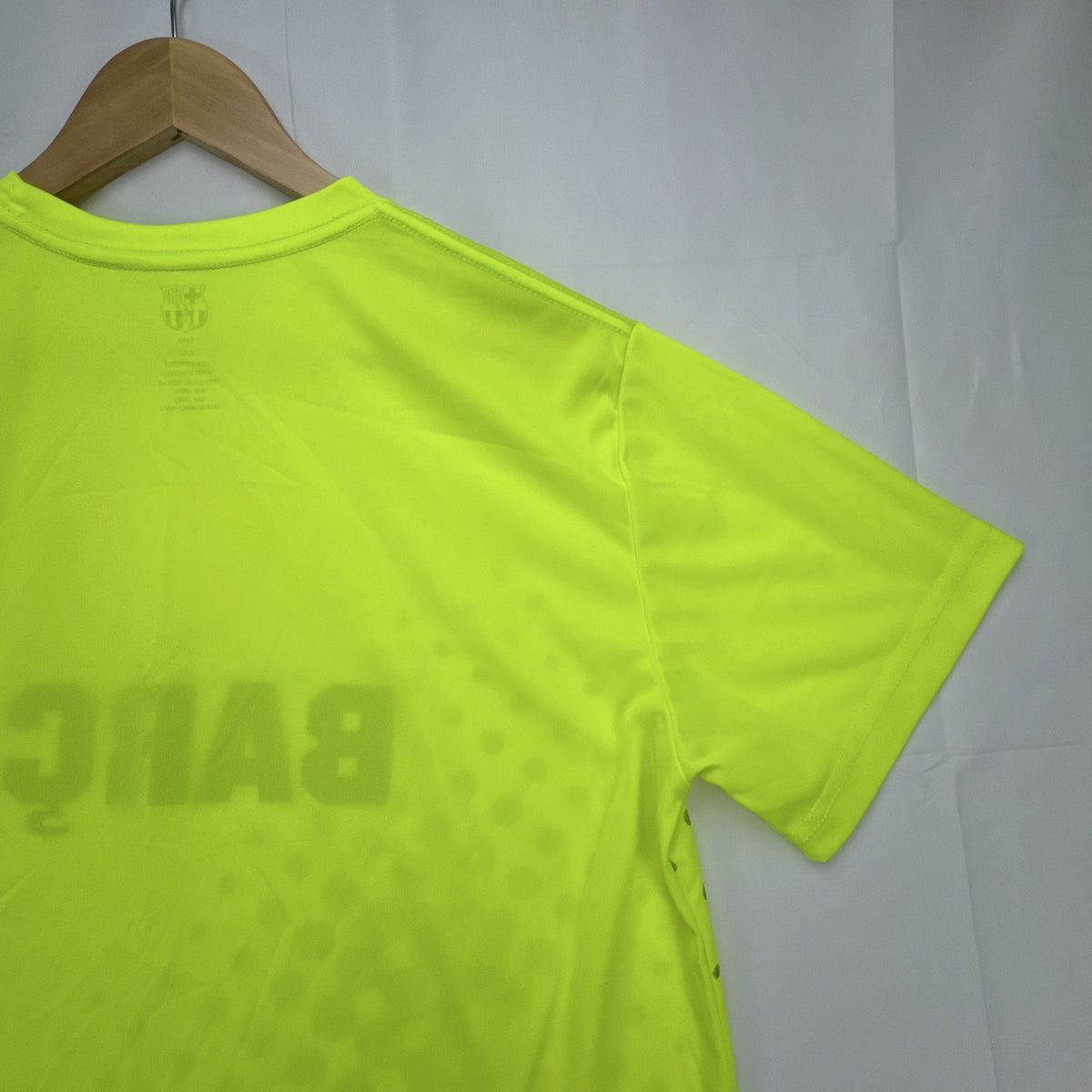 FC Barcelona neon yellow short sleeve soccer jersey with Barça crest graphic in men's size large