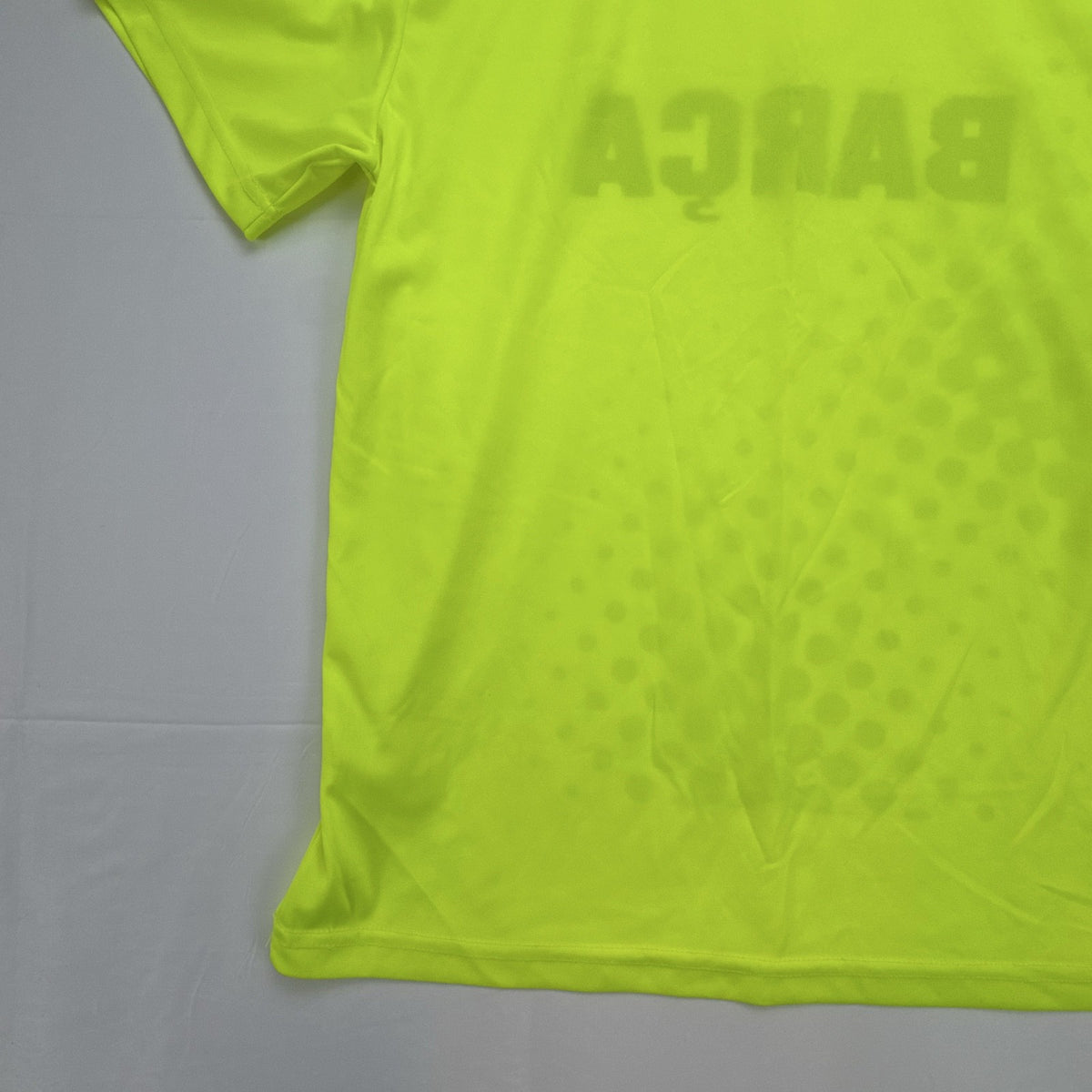 FC Barcelona neon yellow short sleeve soccer jersey with Barça crest graphic in men's size large