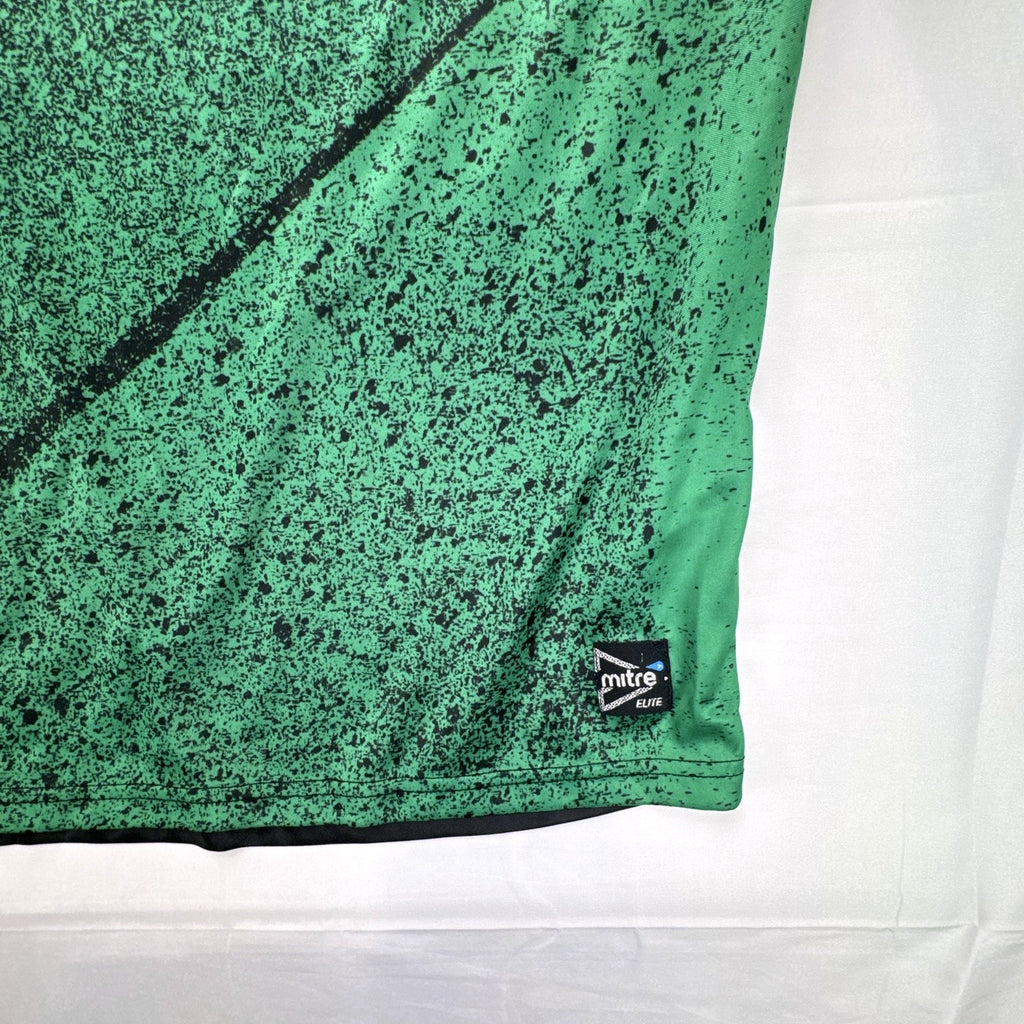 Mitre Mexico soccer jersey in black with green geometric print and red trim, men's size XL.