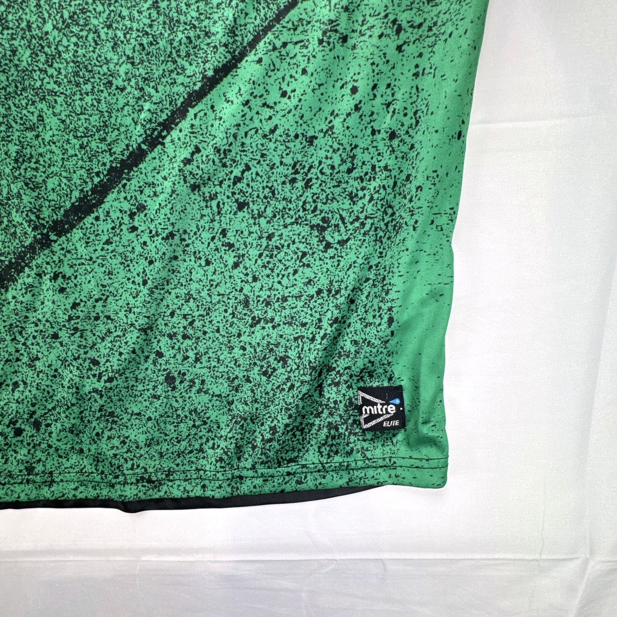 Mitre Mexico soccer jersey in black with green geometric print and red trim, men's size XL.