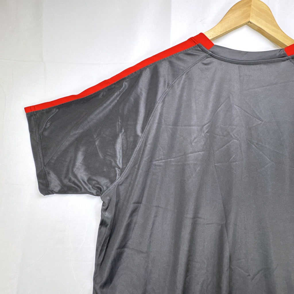 Mitre Mexico soccer jersey in black with green geometric print and red trim, men's size XL.