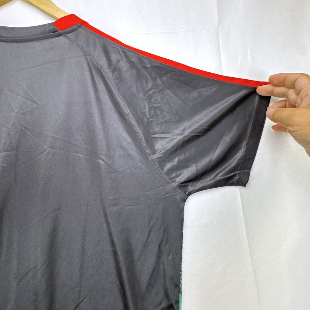 Mitre Mexico soccer jersey in black with green geometric print and red trim, men's size XL.