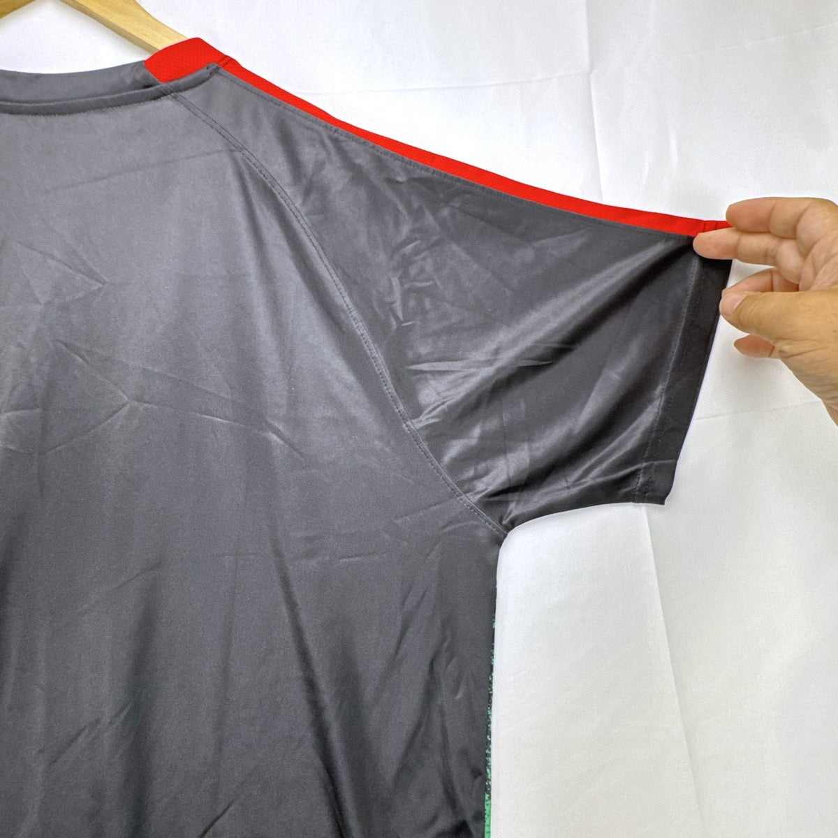 Mitre Mexico soccer jersey in black with green geometric print and red trim, men's size XL.