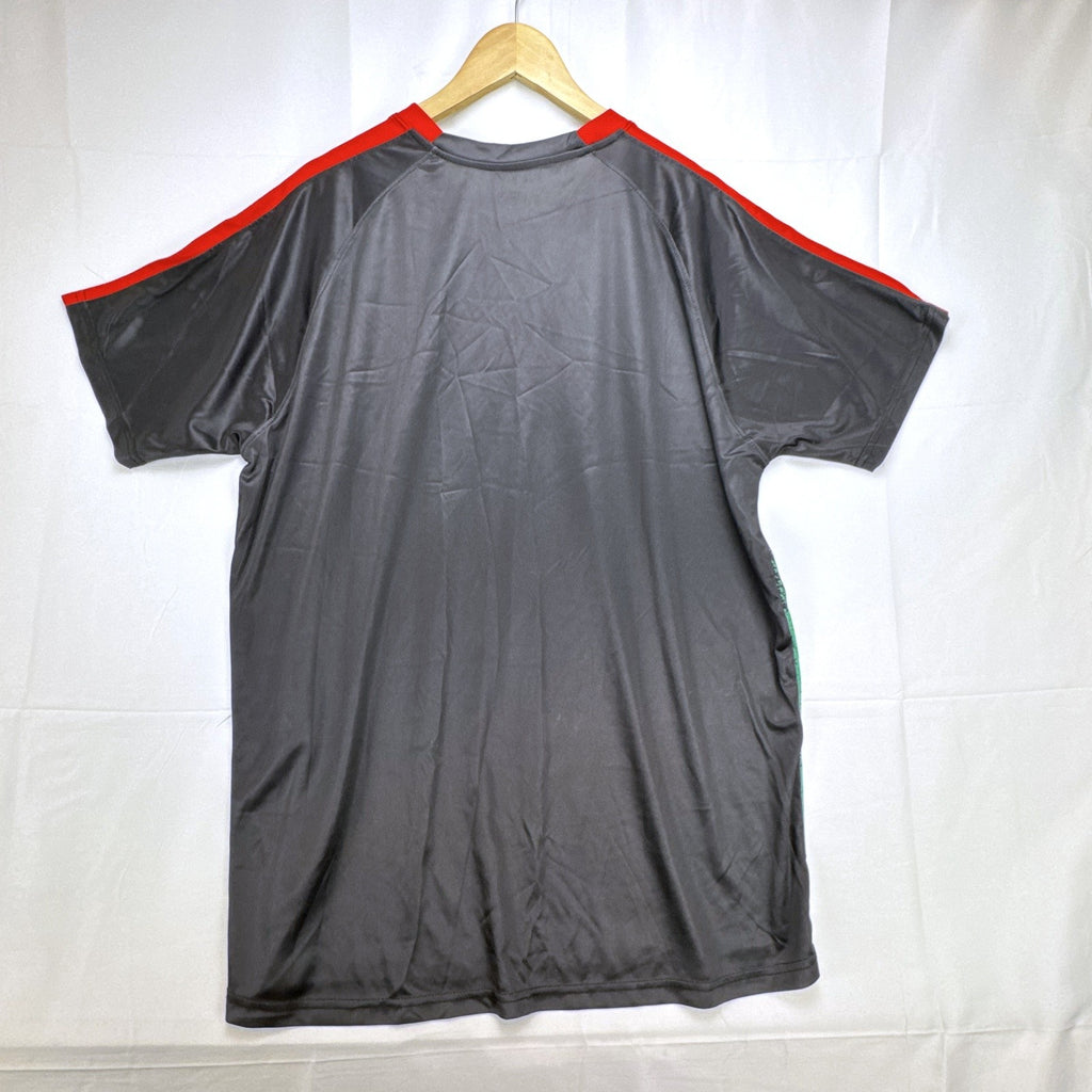 Mitre Mexico soccer jersey in black with green geometric print and red trim, men's size XL.