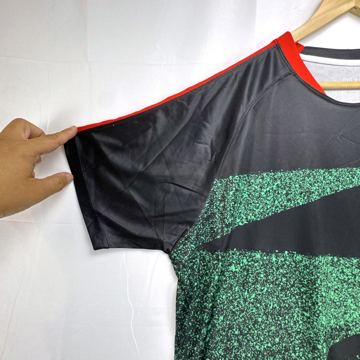 Mitre Mexico soccer jersey in black with green geometric print and red trim, men's size XL.