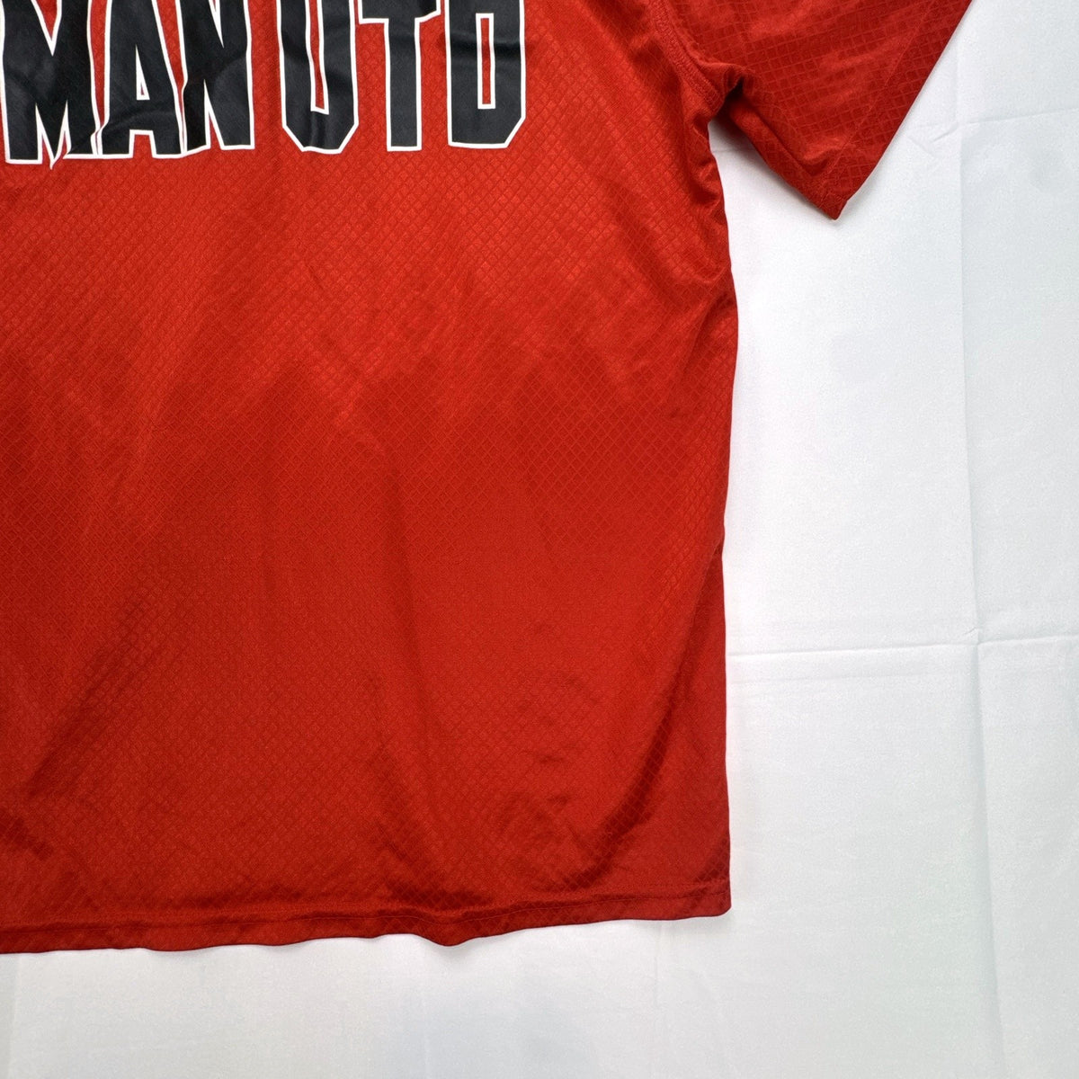 Manchester United men's red soccer jersey in size XL with chest crest and diamond knit pattern