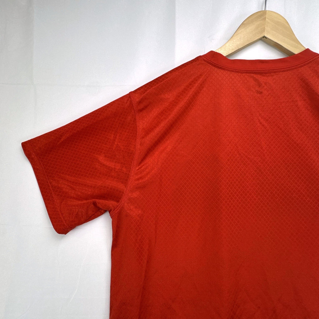 Manchester United men's red soccer jersey in size XL with chest crest and diamond knit pattern