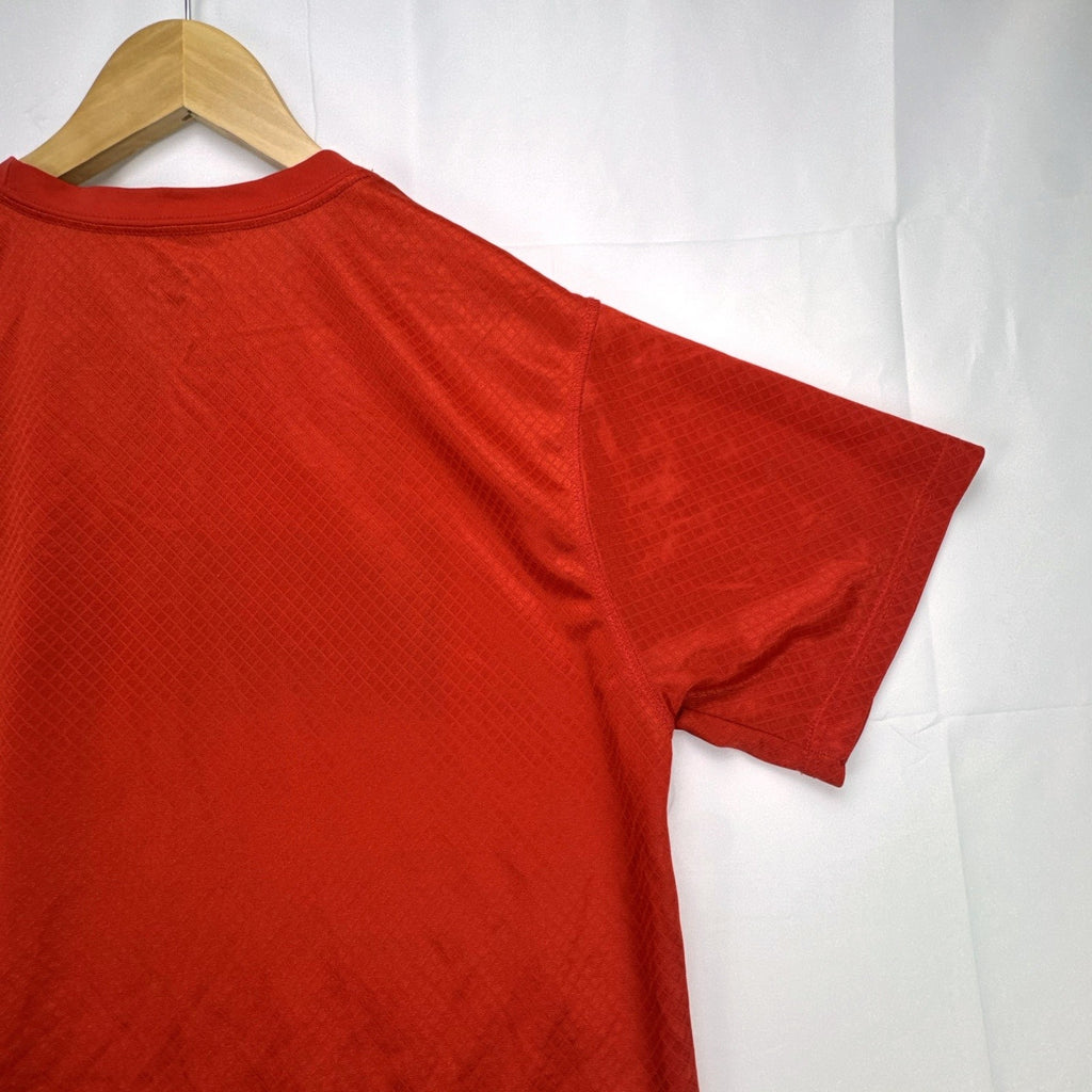 Manchester United men's red soccer jersey in size XL with chest crest and diamond knit pattern
