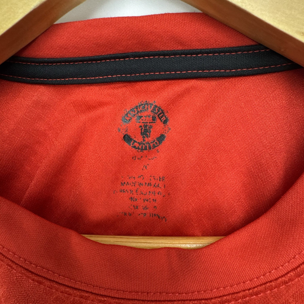 Manchester United men's red soccer jersey in size XL with chest crest and diamond knit pattern