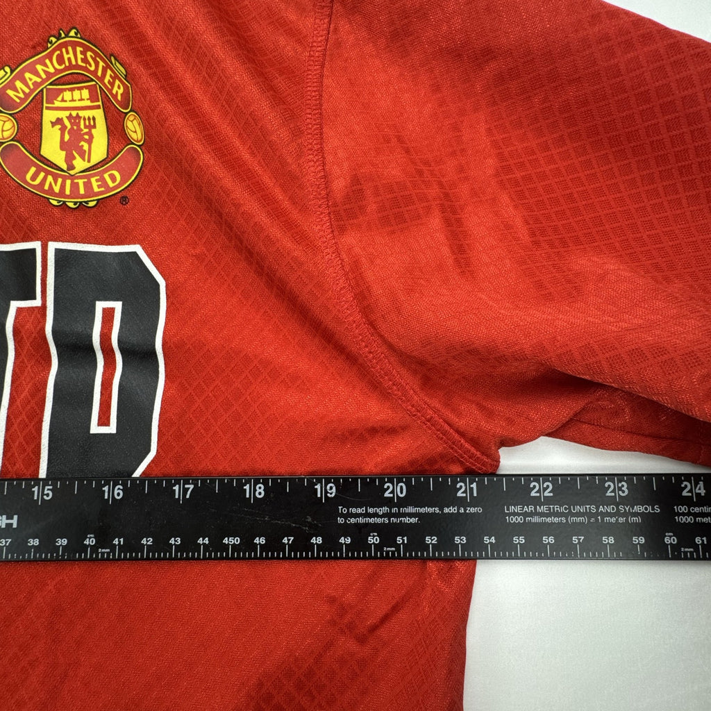 Manchester United men's red soccer jersey in size XL with chest crest and diamond knit pattern