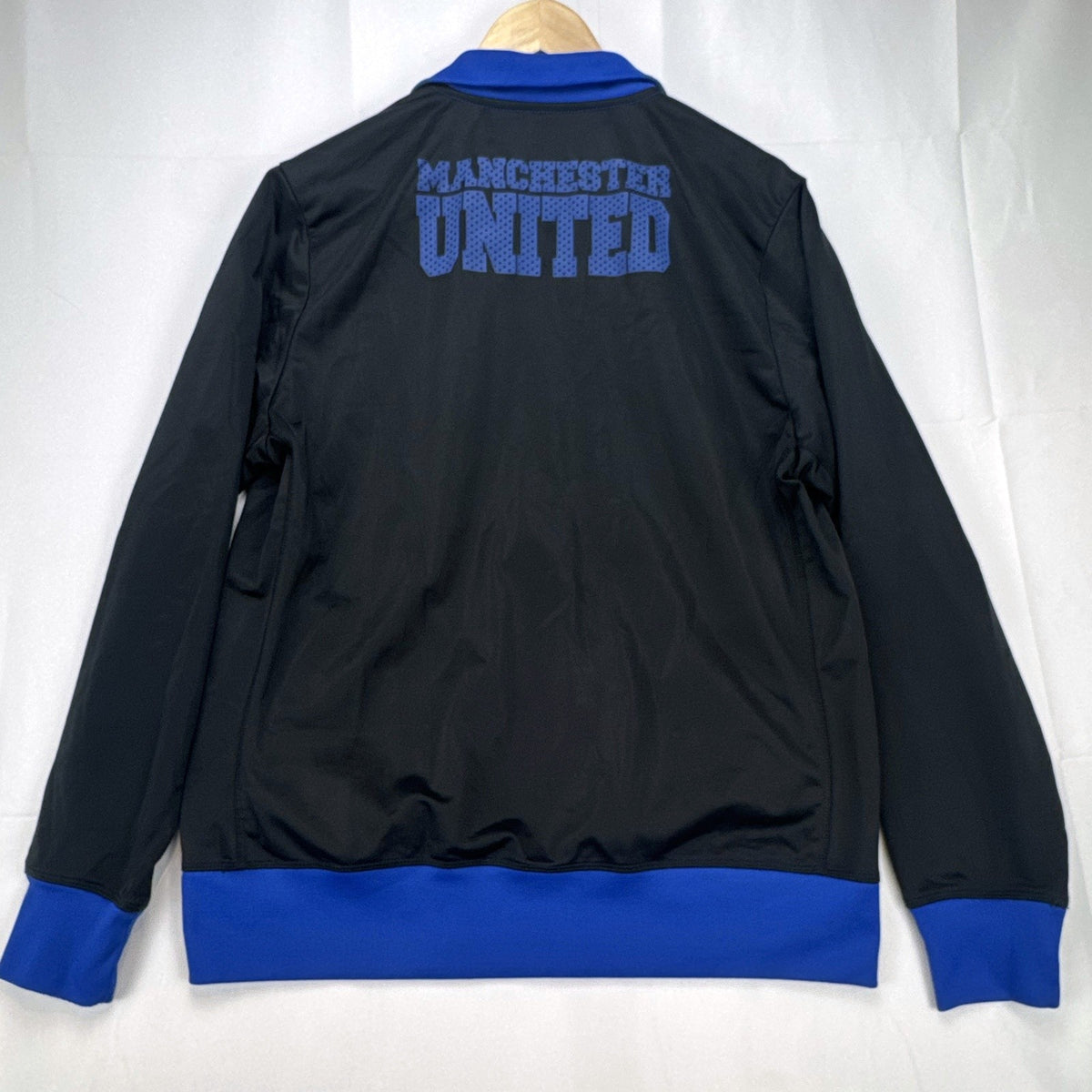 Manchester United men's full-zip soccer warmup track jacket in black and blue, size large