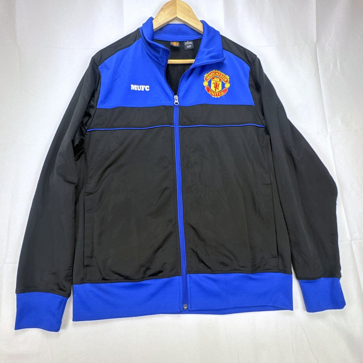 Manchester United men's full-zip soccer warmup track jacket in black and blue, size large