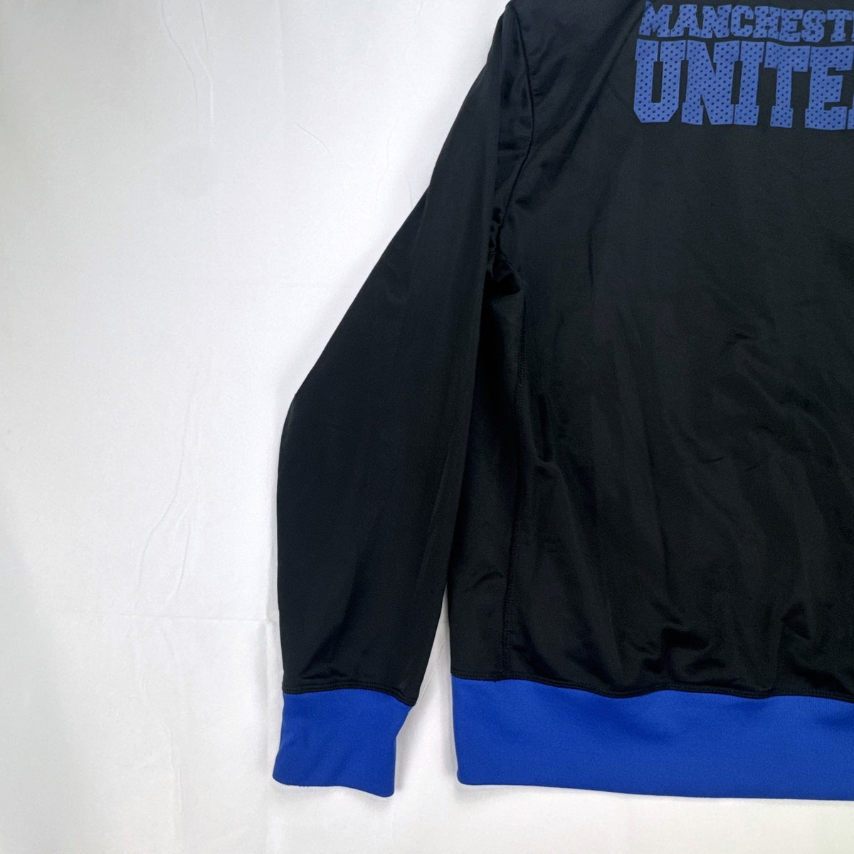 Manchester United men's full-zip soccer warmup track jacket in black and blue, size large