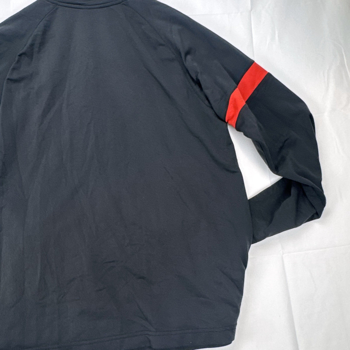 Manchester United men's large full-zip track jacket in black and red with embroidered club crest