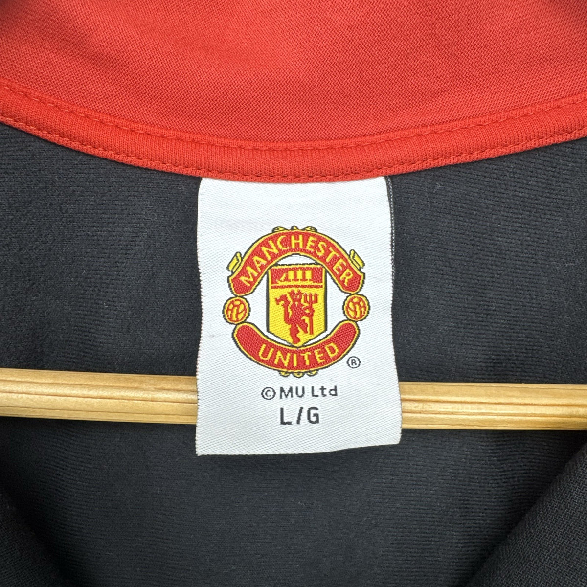 Manchester United men's large full-zip track jacket in black and red with embroidered club crest