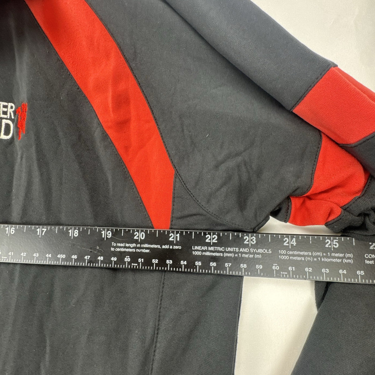 Manchester United men's large full-zip track jacket in black and red with embroidered club crest