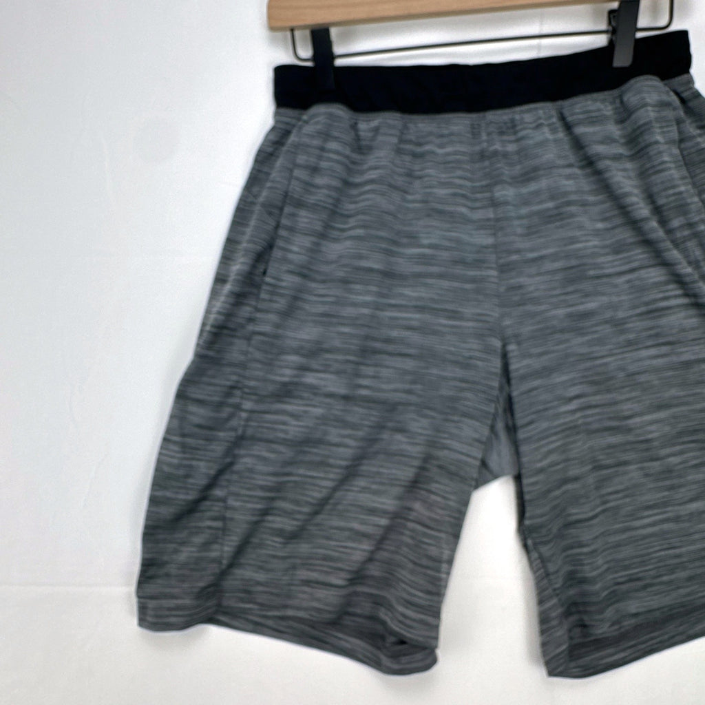 Men's small adidas Climalite athletic shorts in heather gray with black elastic waistband and side pockets.