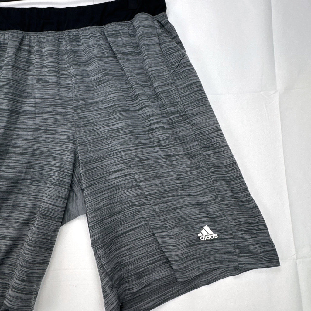 Men's small adidas Climalite athletic shorts in heather gray with black elastic waistband and side pockets.