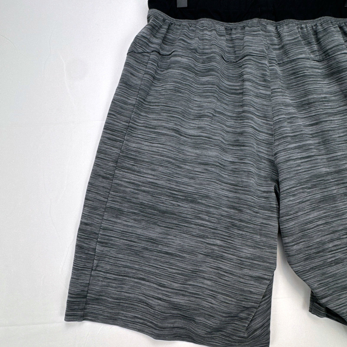 Men's small adidas Climalite athletic shorts in heather gray with black elastic waistband and side pockets.
