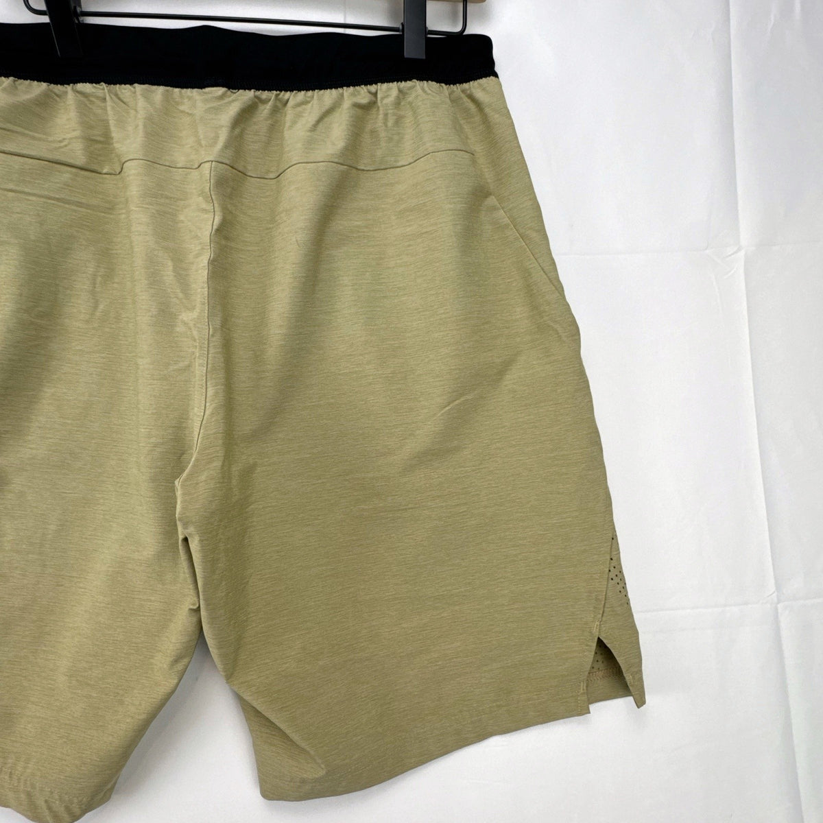 Adidas men's heather beige athletic training shorts in size medium with black elastic waistband and side vents